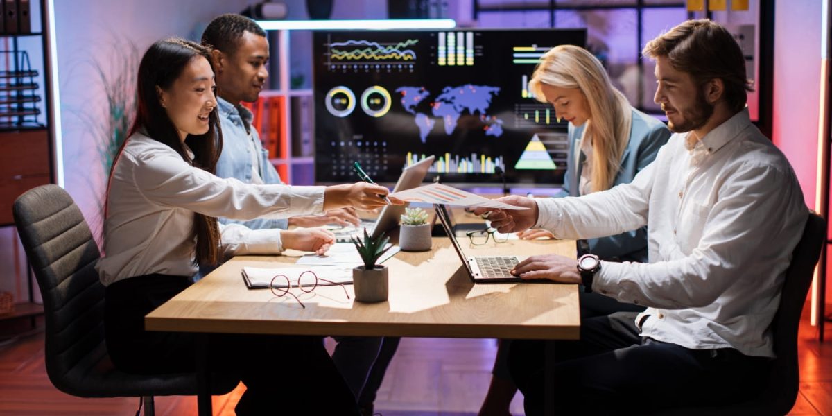 financial-experts-with-modern-gadgets-working-at-o-2023-11-27-05-16-02-utc-min.jpg